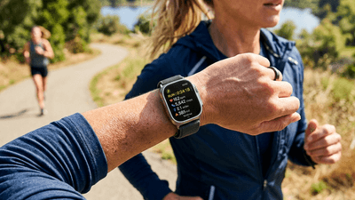 Modern smartwatch displaying health metrics on a wrist during exercise